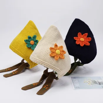 Karšto pardavimo Europos ir Amerikos baby vilnos megzti skrybėlę su mielas gėlių dizainas, puikiai tinka rudenį ir žiemą. Nustatyta, pro ausis